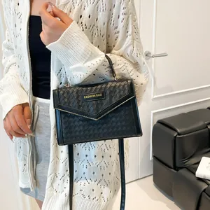 Elegant black woven texture crossbody bag with top handle and fashion logo plaque