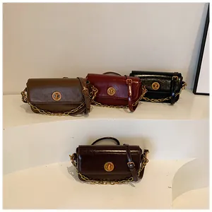 Close-up of vintage small square bags with metal locks in four classic autumn colors