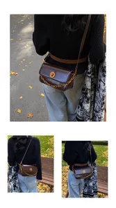 Detail of dark brown leather crossbody bag with gold chain and twist lock on model