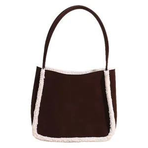 Brown suede tote bag with white faux fur trim and minimalist leather shoulder strap