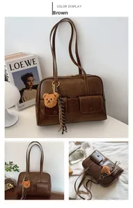 Detailed views of brown vintage tote bag with multi-pockets and plush bear charm