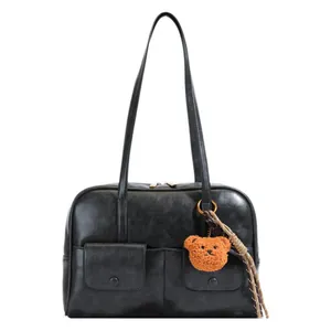 Retro black shoulder bag with dual front pockets and cute brown bear pendant accessory