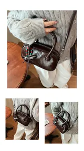Detail of vintage dark brown glossy shoulder bag with star and bead charms