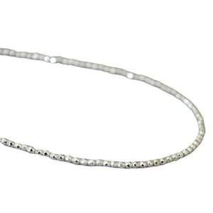 Minimalist faceted silver beaded necklace featuring a sparkling diamond-cut chain for women