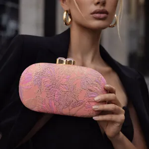 Pink floral embroidered evening clutch bag with gold clasp and gemstone detail