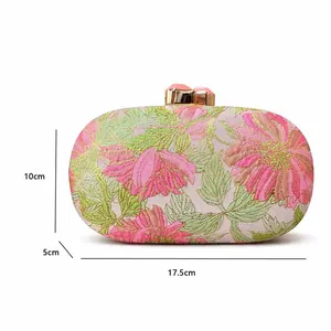 Detail view of floral evening clutch bag with embroidery and dimensions 17.5x10x5cm