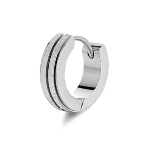 Detail of silver-tone titanium hoop earring featuring brushed finish and black parallel grooves
