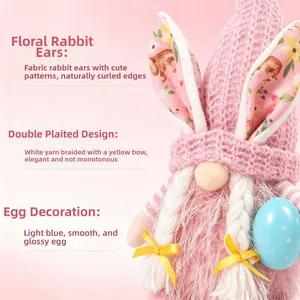 Close-up detail of a pink Easter gnome with floral fabric ears and white yarn braids.
