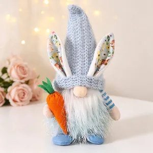 Detailed close-up of a blue Easter gnome plush doll with rabbit ears and carrot