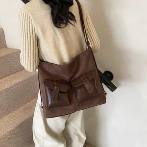 Large dark brown suede crossbody bag with vintage multi-pockets and shoulder strap