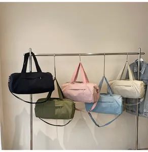 Detailed display of cylinder yoga bags in various colors on a metal hanger