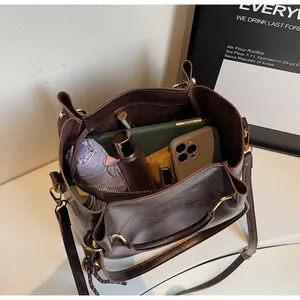 Detail view of large interior capacity for a dark brown vintage PU leather tote bag