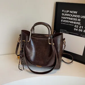 Women Vintage PU Leather Tote Bag Large Capacity Commuter Shoulder Crossbody Bag Triangle Metal Logo Braided Bell Pendant