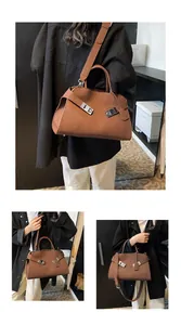Macro detail of retro brown leather tote bag with silver locks and adjustable strap