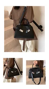 Three-way view of a black leather tote bag with silver twists on stairs