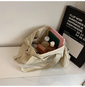 Top view of large canvas yoga bag interior showing spacious capacity for daily essentials