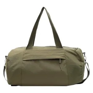 Olive green cylindrical sports gym bag in waterproof nylon fabric with crossbody strap