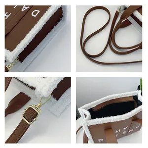 Dettagli della borsa tote marrone con bordo in shearling e clip in metallo dorato