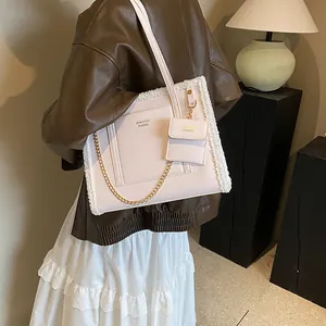 Pink faux fur tote bag with gold chain and matching small pouch for women