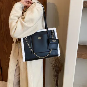 Black PU leather tote bag with white fleece trim and gold chain detail for autumn