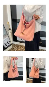 Detailed view of pink fuzzy hobo bag with checkered lining and drawstring closure