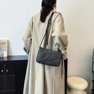 Dark grey chic chain underarm bag with thick rope shoulder strap and metallic detail