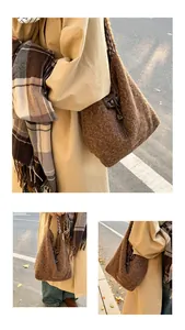 Detail of a brown faux fur bucket bag with a leather drawstring and plaid lining texture