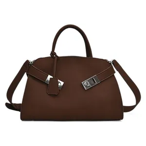 Deep brown matte leather tote bag with silver metal buckles and detachable shoulder strap