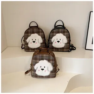 Detail of plaid tote bag featuring cute cartoon dog embroidery and premium PU leather trim
