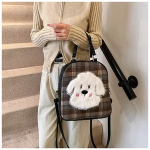 Brown checkered tote bag with cute plush puppy patch shown on a staircase model