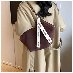 Detail of checkered fabric tote bag with Chia'2nd ribbon and suede brown finish