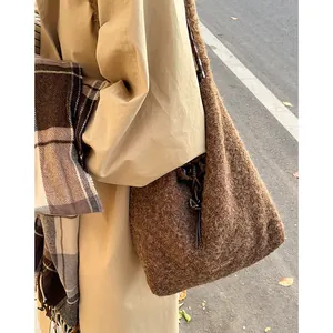 Brown fluffy plush tote bag with leather label and drawstring strap for autumn
