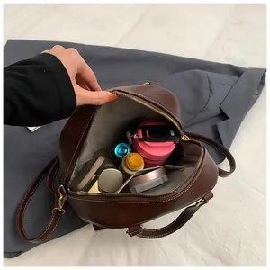 Top view of large brown leather tote bag interior showing spacious storage capacity