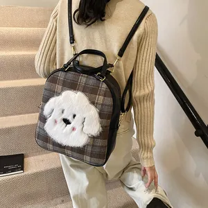 Fashionable brown checkered tote bag featuring a cute white cartoon puppy and leather trim