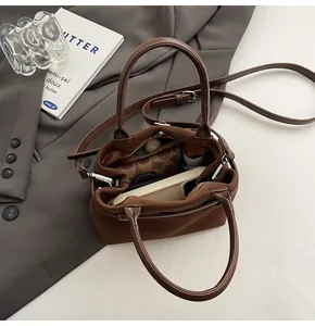 Top view of brown matte leather tote bag interior showing ample capacity for essentials
