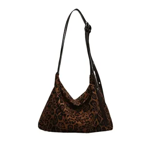 Retro leopard print tote bag with adjustable brown leather shoulder strap in hobo style