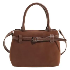 Mini brown frosted leather tote bag with bucket shape and adjustable shoulder strap