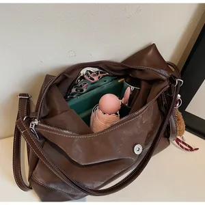 Spacious interior of retro brown tote bag showing capacity for daily essentials