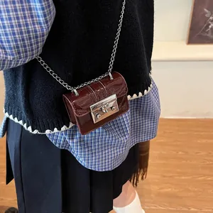 Mini burgundy lychee pattern crossbody bag with silver chain and metal lock closure