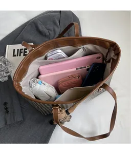 Top view of large houndstooth tote bag interior with spacious pockets and organizer