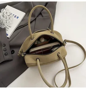 Top view of compact Boston bag interior showing space for phone and essentials