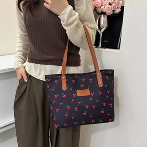 Sweet cherry print tote bag with brown faux leather handles and spacious interior