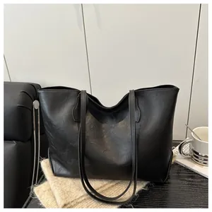 Macro shot of high-quality black PU leather texture on minimalist tote bag with matte finish