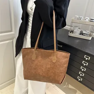 Retro dark brown high-capacity tote bag with vintage texture and sleek shoulder straps