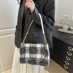 Elegant plaid shoulder bag with textured tweed fabric and gold metal chain strap