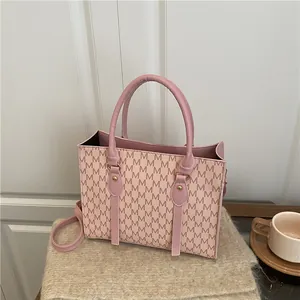 Pink rectangular handbag with M-letter prints and detachable strap for women