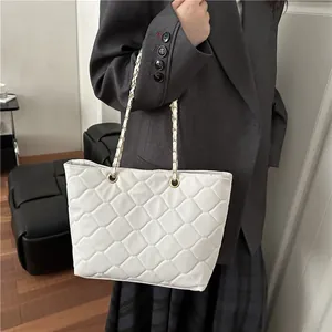 Classic white quilted tote bag for women with gold chain straps and plaid texture design