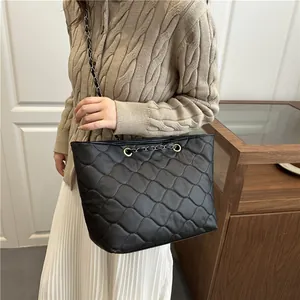 Japanese style quilted tote bag with black diamond pattern and gold chain strap
