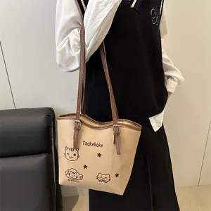 Large beige tote bag with cute cartoon cat illustrations and brown shoulder strap