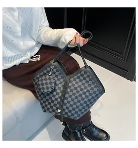 Detail of grey checkered tote bag with matching round coin purse and drawstring detail